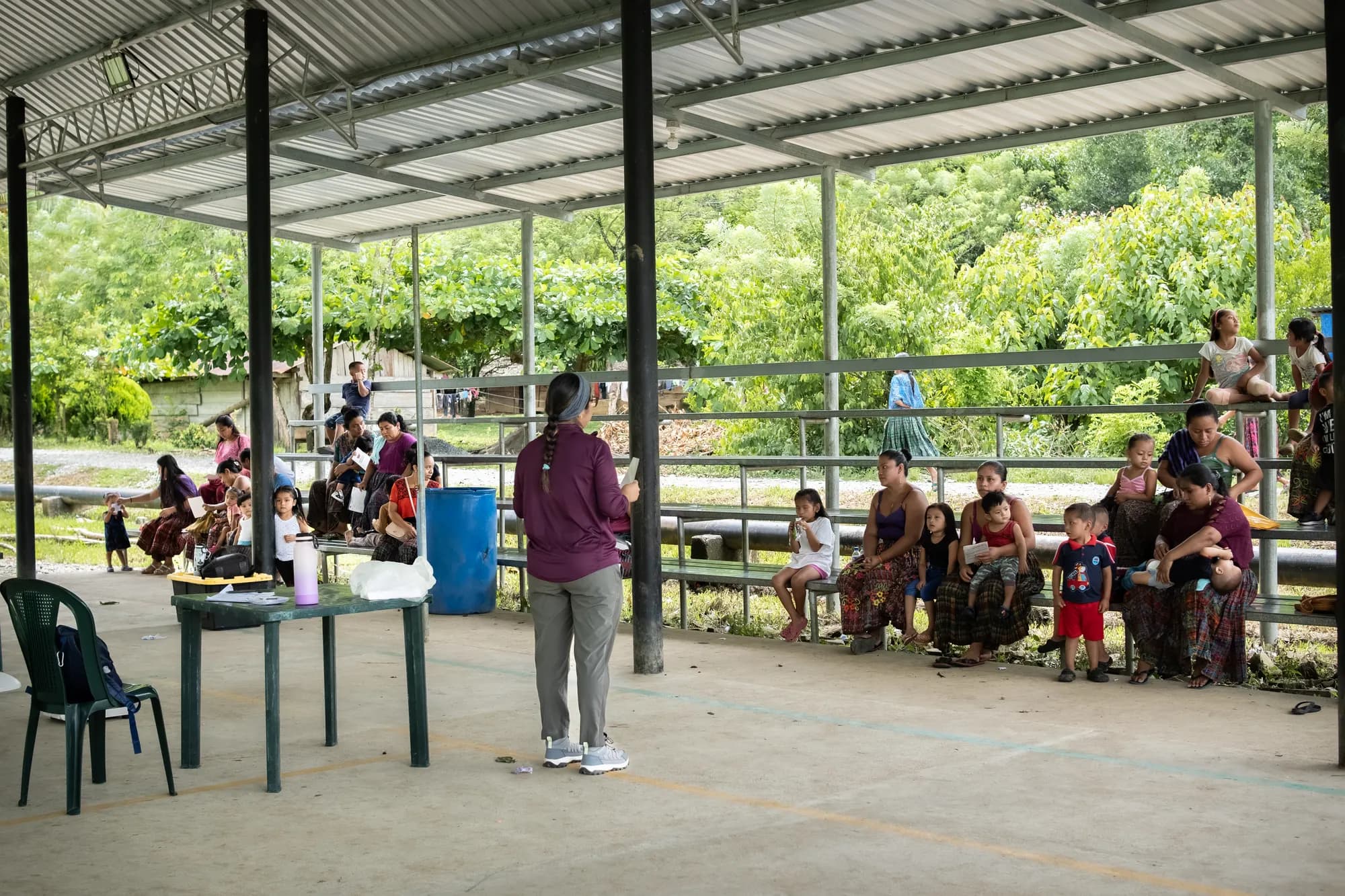 Families gather for an El Faro child nutrition screening day.
