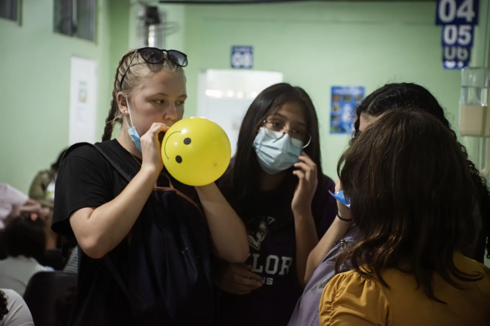 A volunteer supports a health screening in a Guatemalan community.