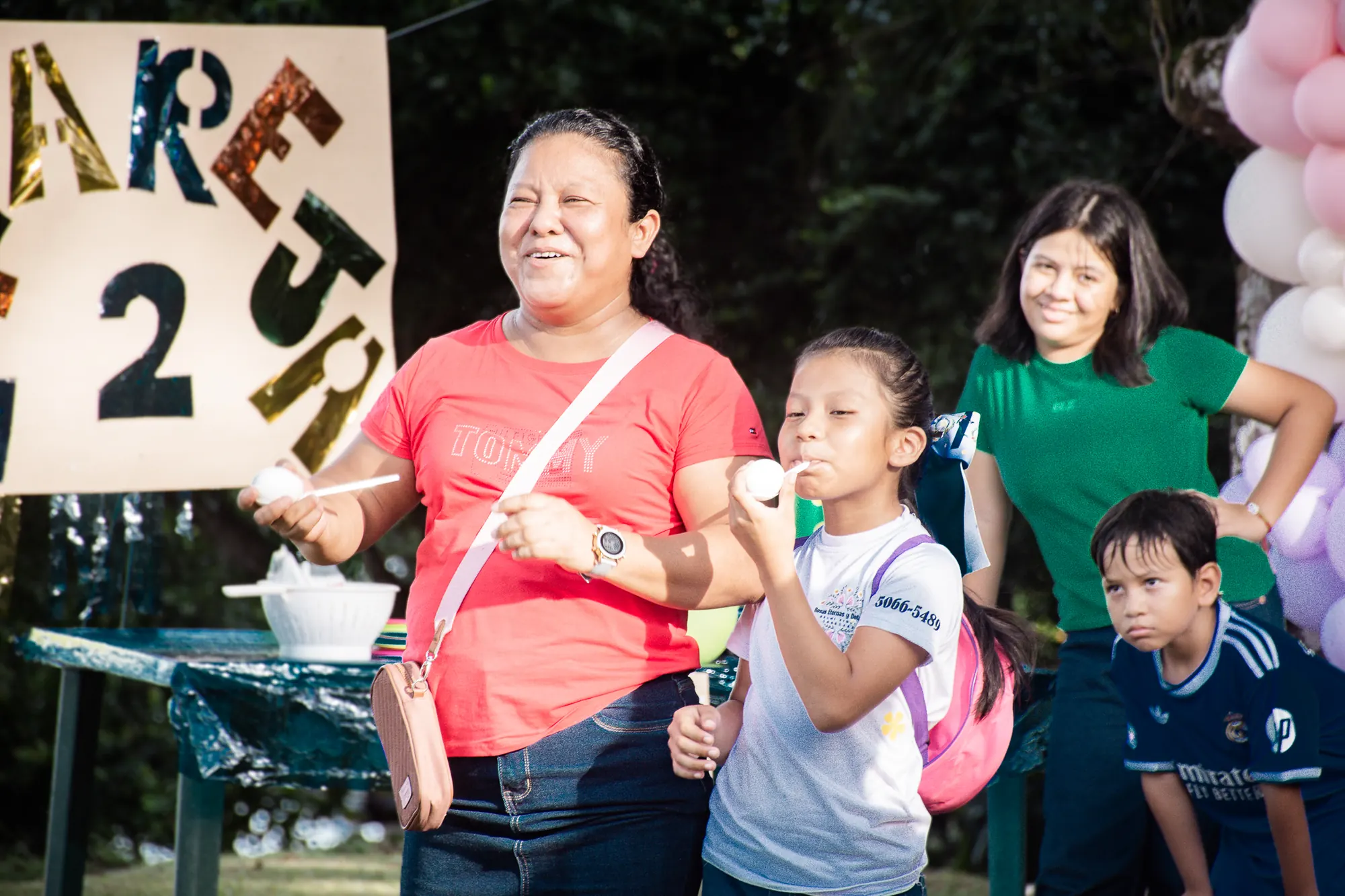Children celebrate together during an El Faro family program.