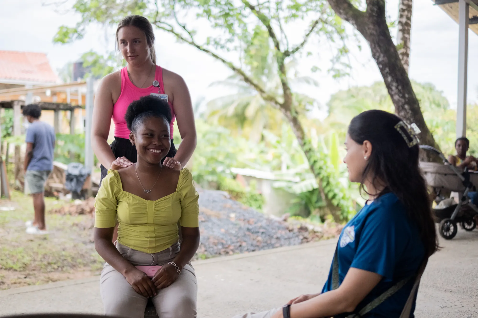 A medical mission volunteer speaks with a young patient.