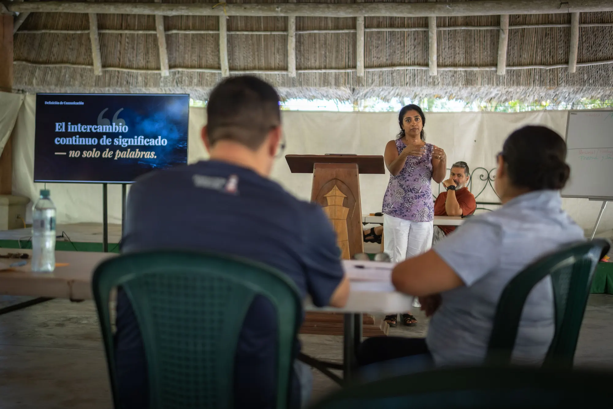 A speaker leads a marriage retreat session at El Faro.