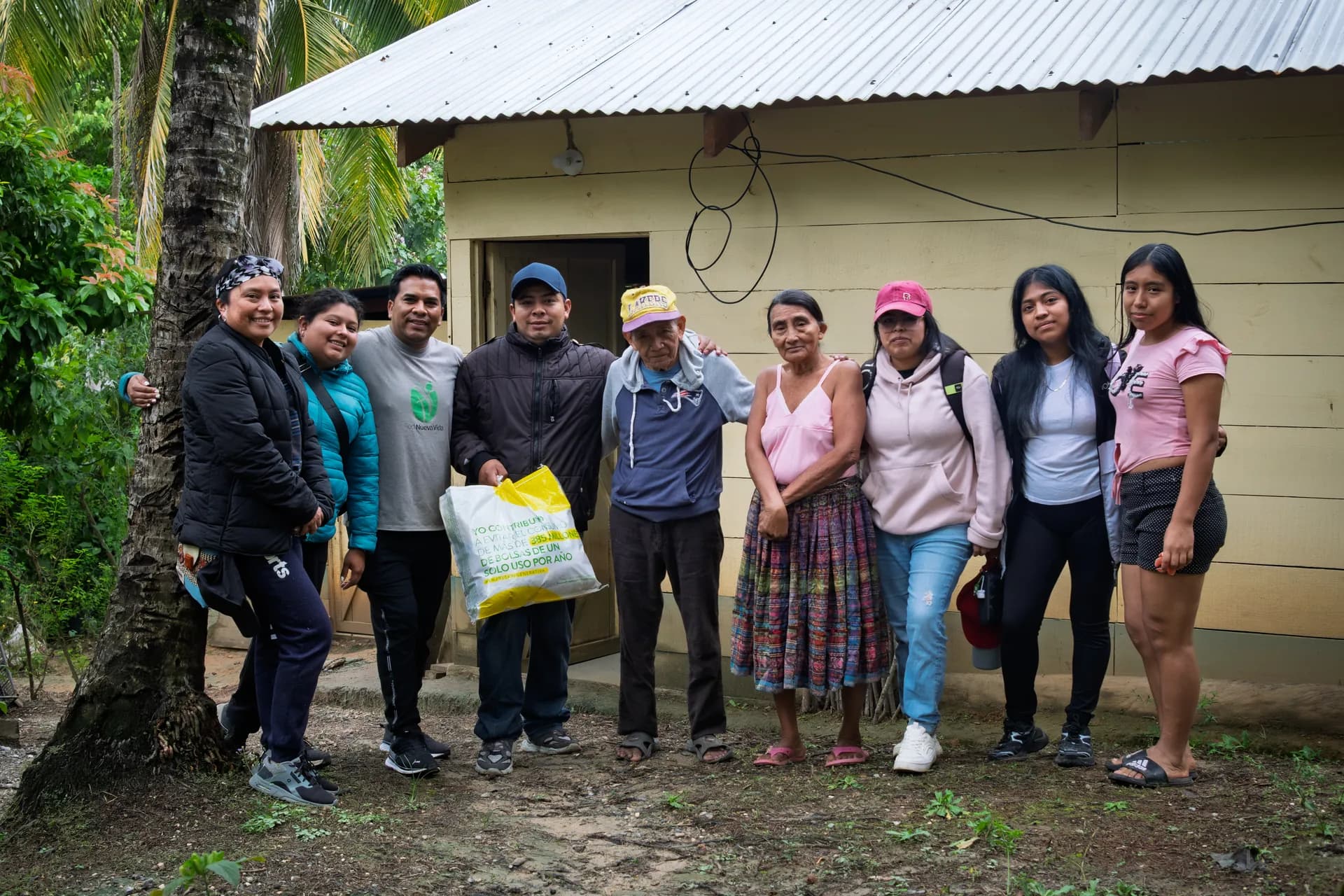 El Faro partners and community members gather after a home visit in Guatemala.