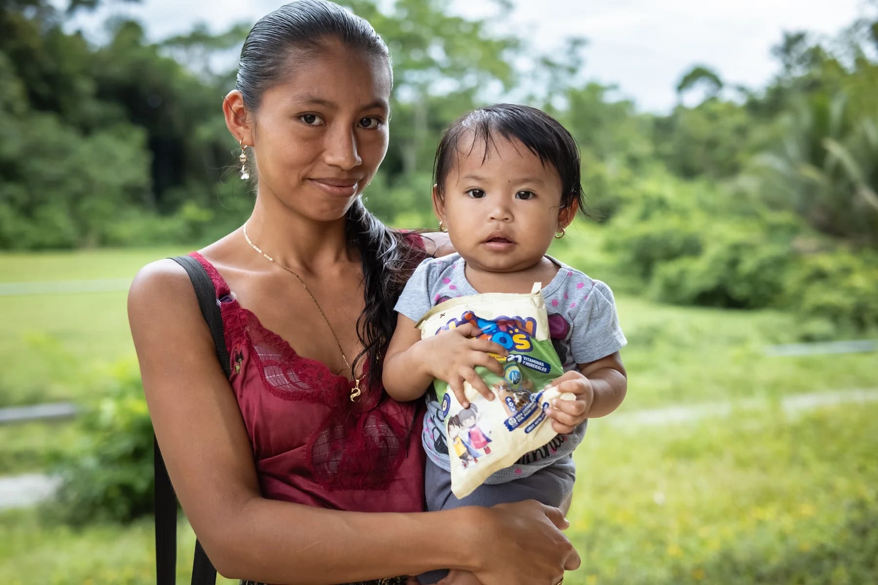 A mother holds her child during a Chispuditos visit.