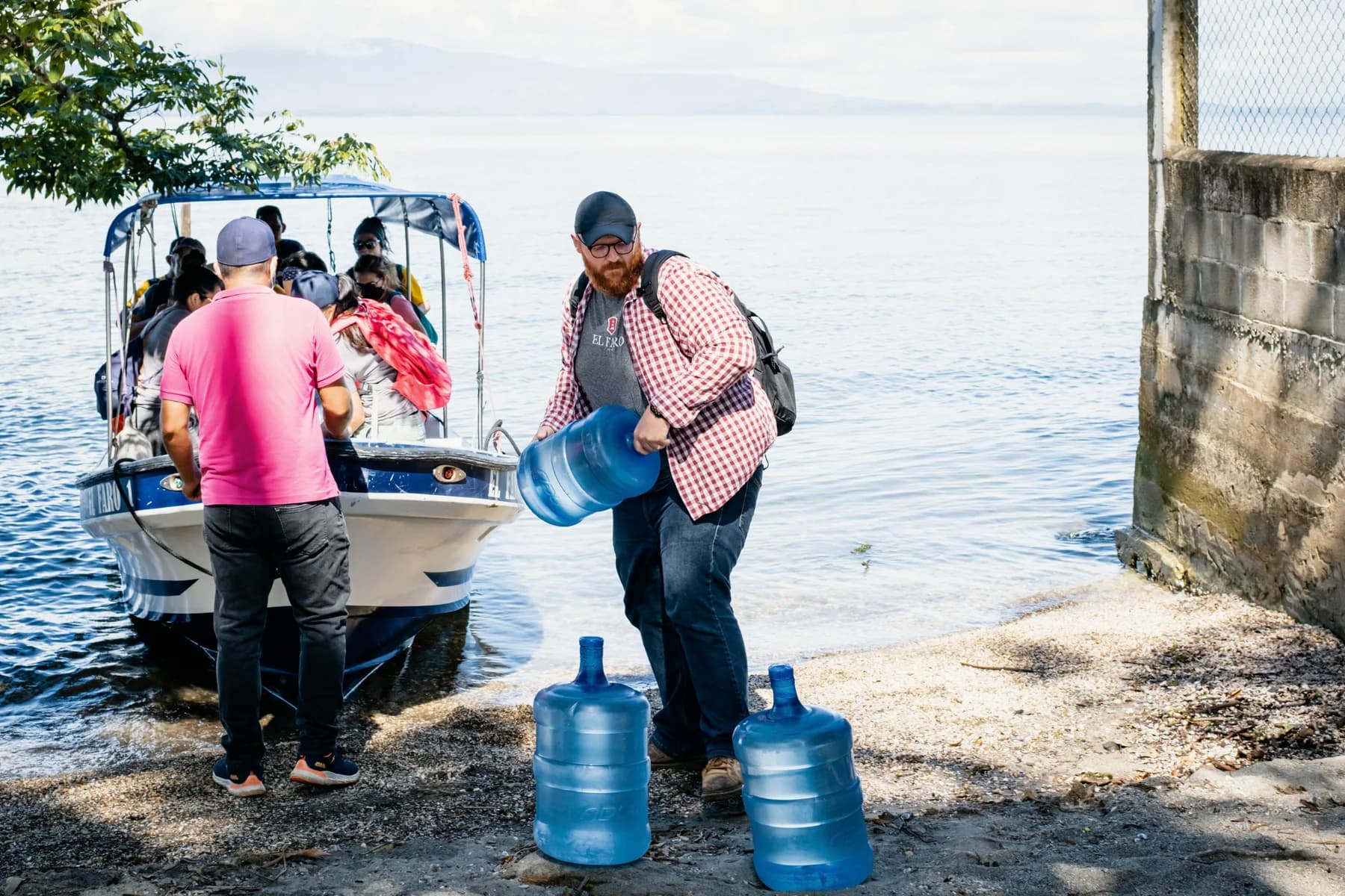 Team members unload drinking water at the dock.