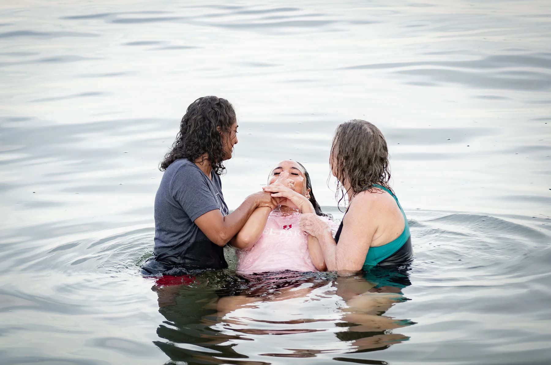 A baptism in the water at El Faro.
