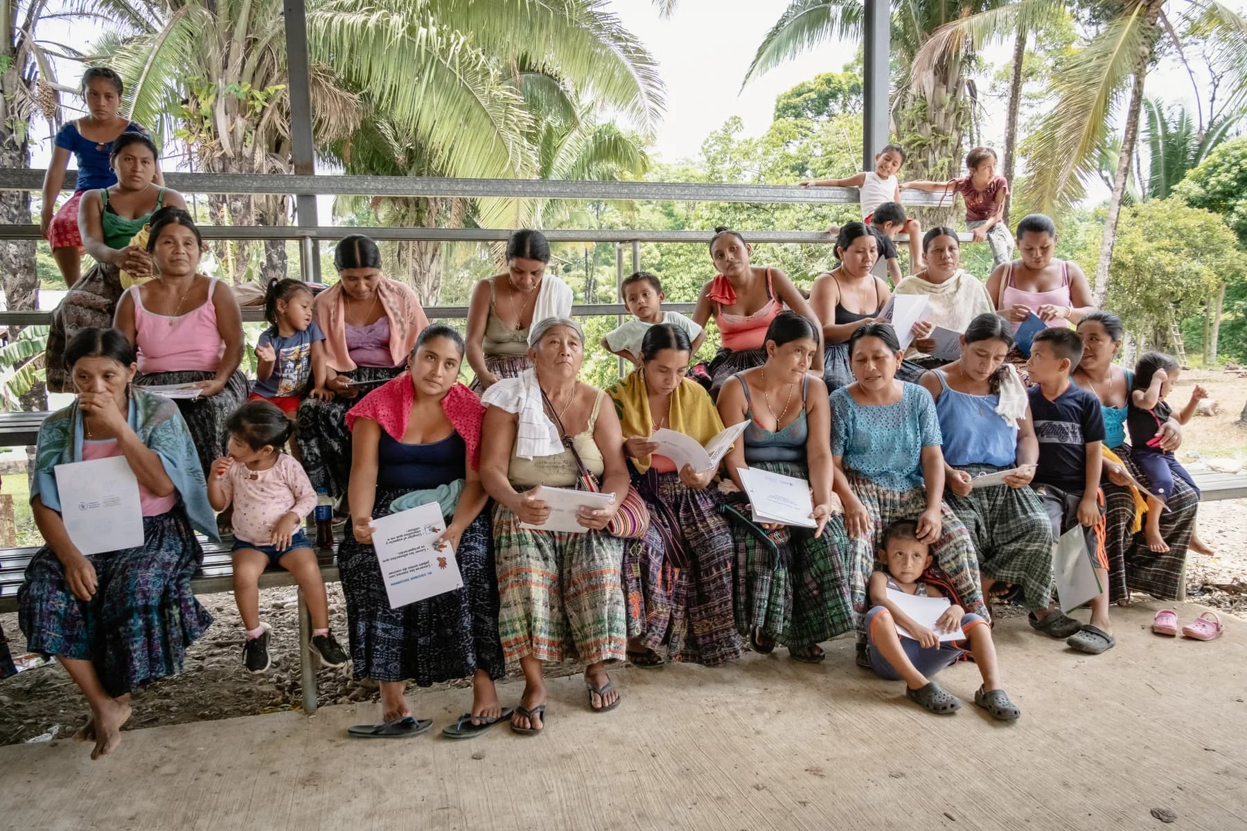 Families gather for a recipe booklet distribution.
