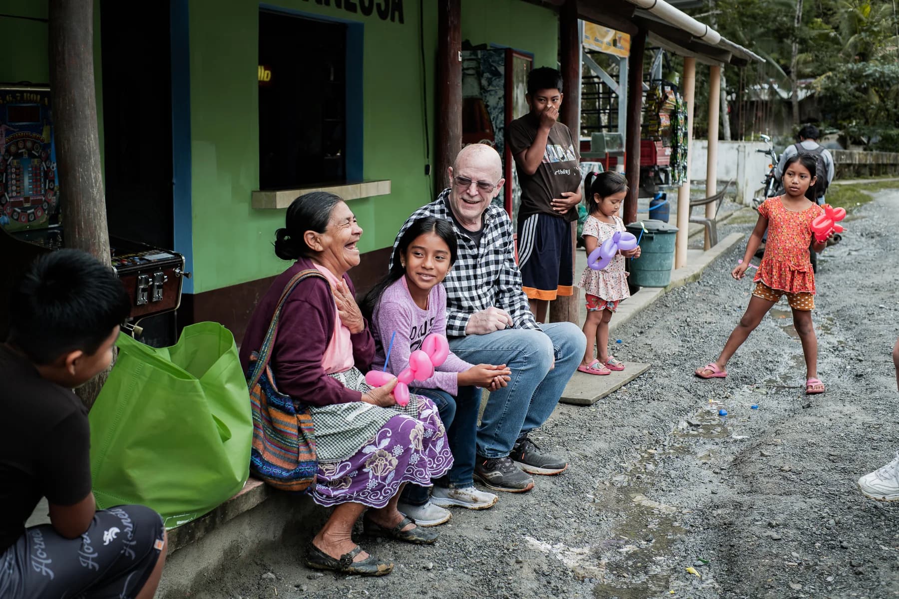 Visitors and residents share time outside a home.